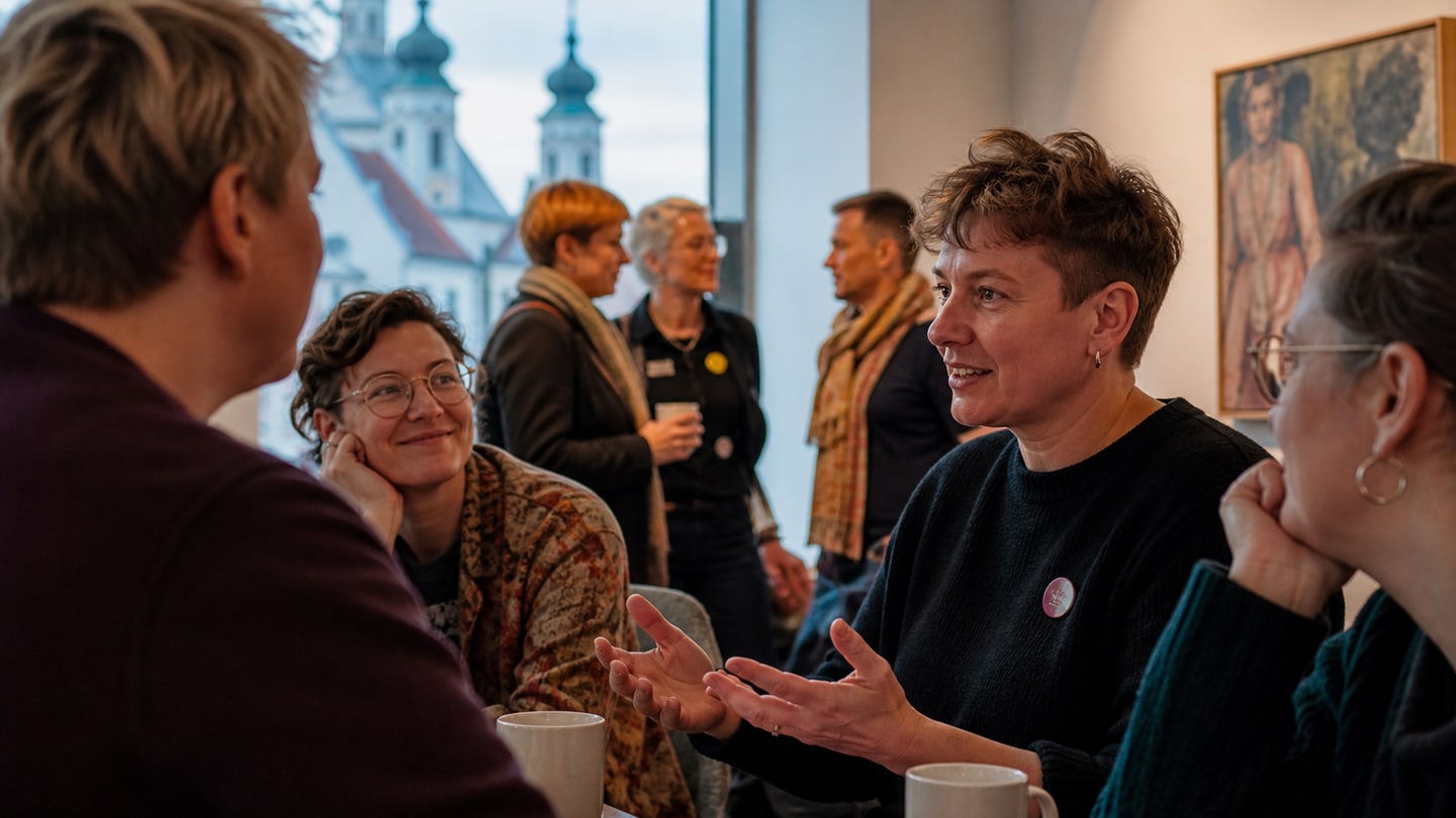 AI-generated editorial scene for Storytelling café: Untold – Queer stories from the Allgäu; not a photograph of the event